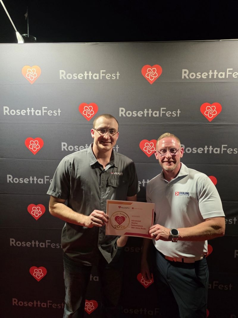 Corry Hull receiving the 2026 Rosie Award at RosettaFest alongside a Vexus Boats representative